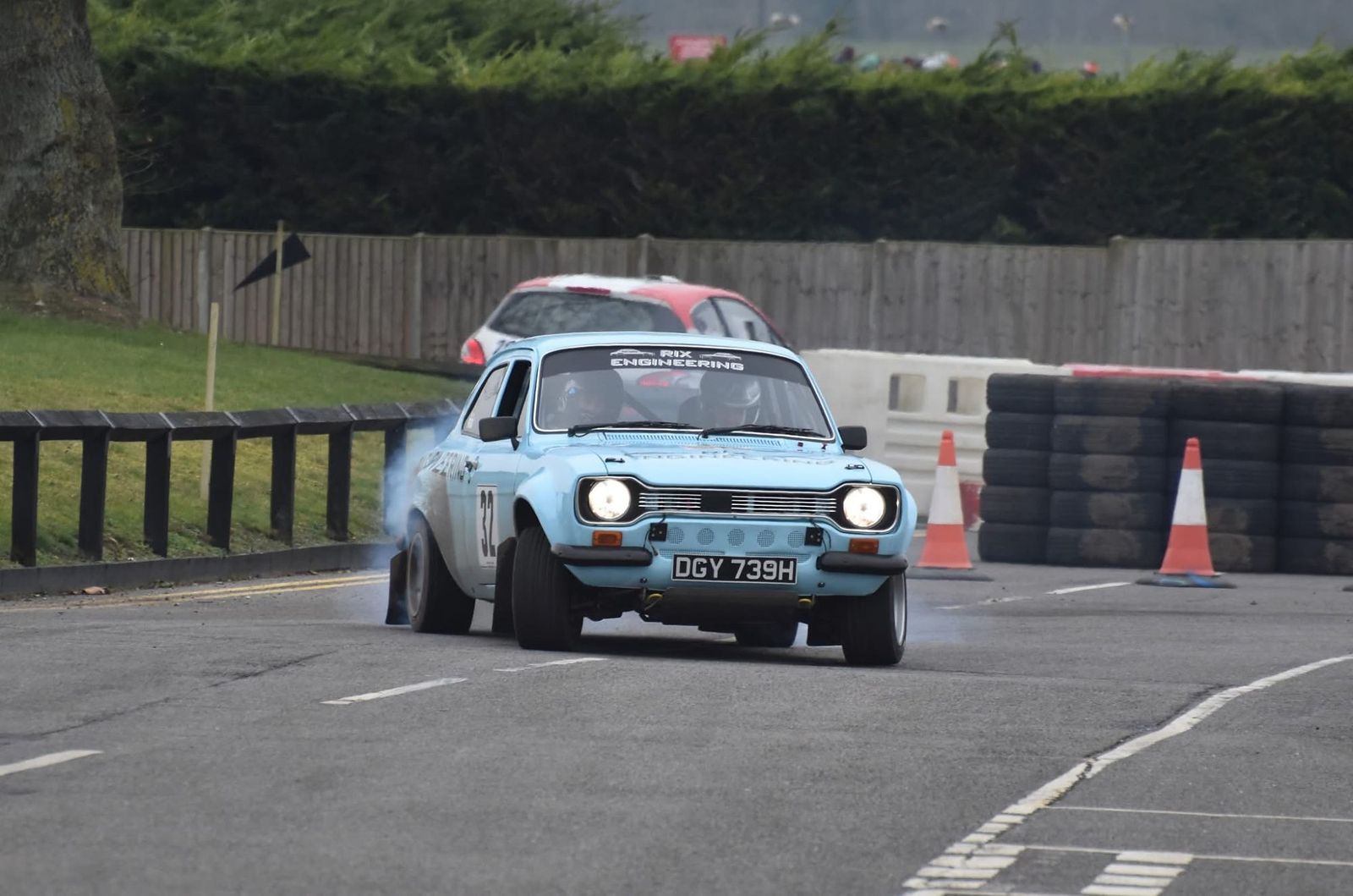 Light blue Ford Escort MK1 on a tarmac sprint course