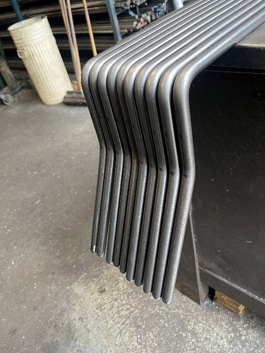 Batch of bent steel tubes