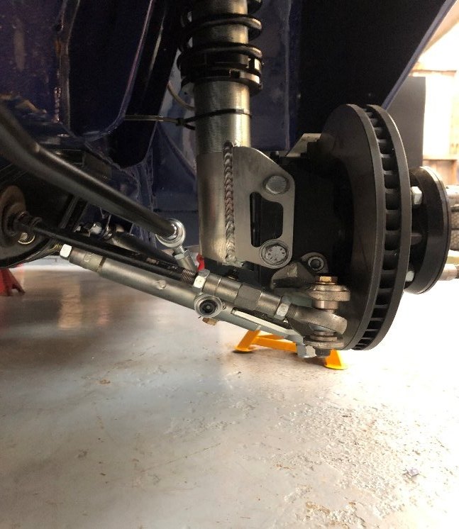 Front suspension strut, hub and brake assembly